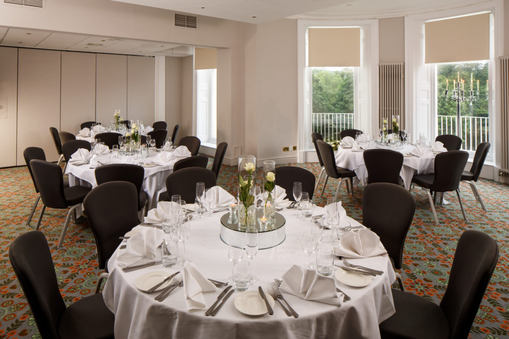Tables with place settings for a luncheon in The Presidential Suite at mercure gloucester bowden hall hotel