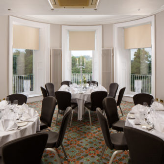 Tables set for private dining in the senate room at mercure gloucester bowden hall hotel