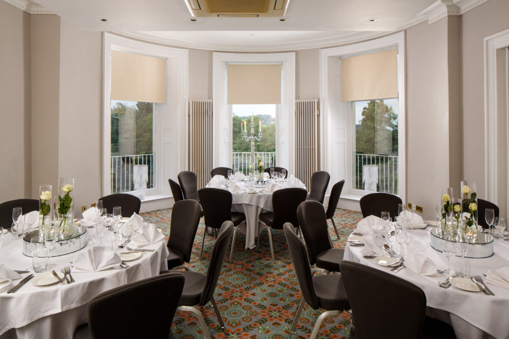 Tables set for private dining in the senate room at mercure gloucester bowden hall hotel