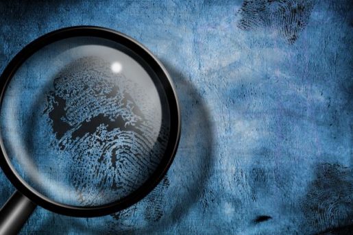 Cartoon style magnifying glass over a black fingerprint on a blue background